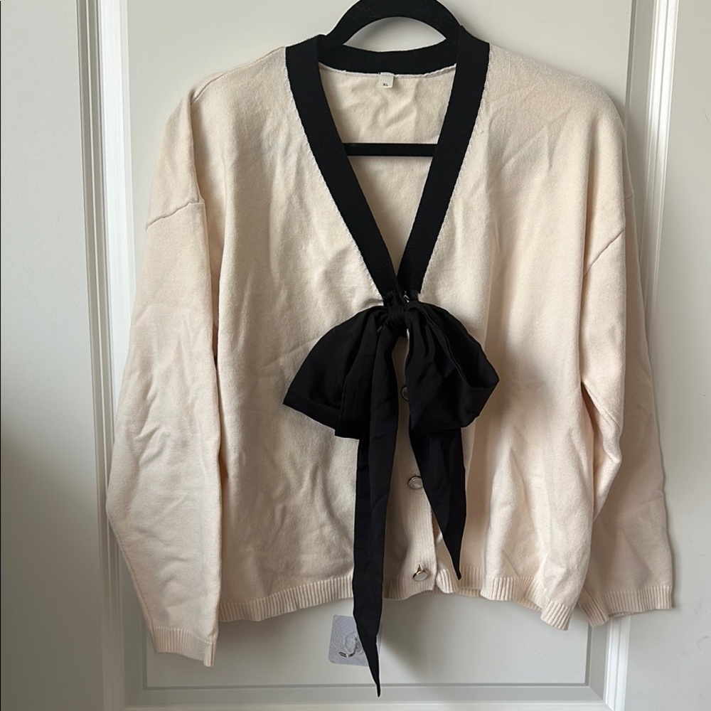 Cream Cardigan with Black Bow Accent